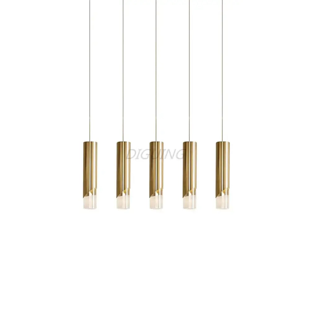Five sleek gold and black led pendant lights with frosted glass hang from cords made of high-quality die-cast aluminum