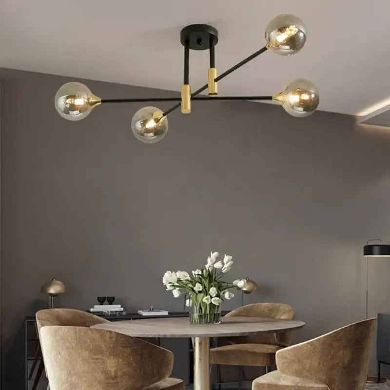 Modern black and gold led round ball chandelier with five spherical glass bulbs for dining room lighting