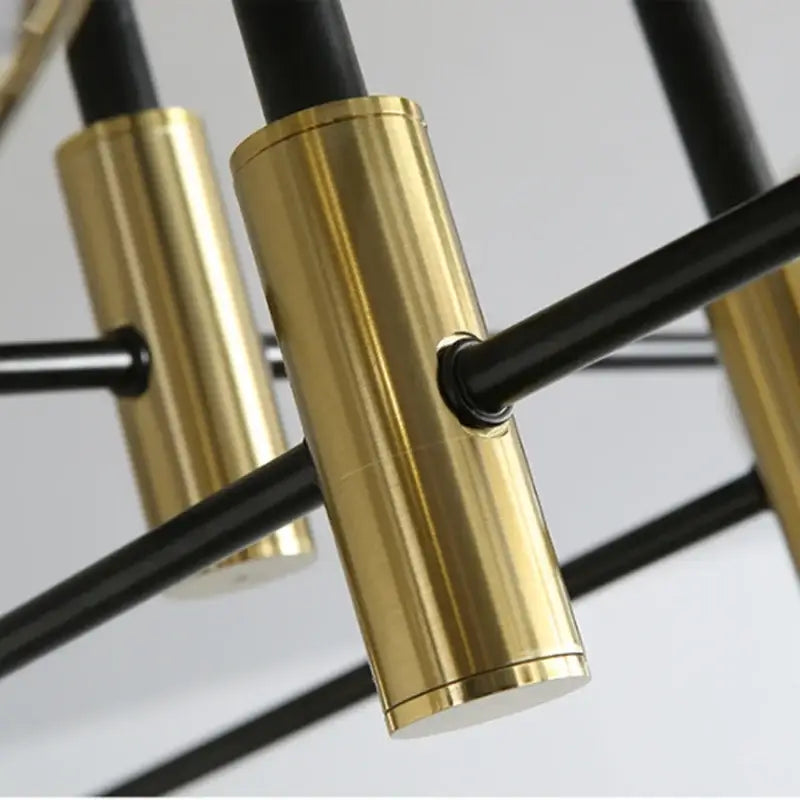 Modern black and gold led round ball chandelier with sleek black and brass cylindrical light fixtures for dining room