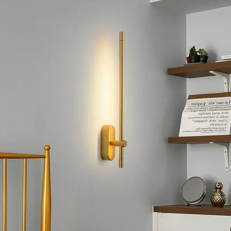 Gold-toned minimalist wall lamp with sleek vertical rod and rectangular base decorbites led strip wall lamp for bedroom