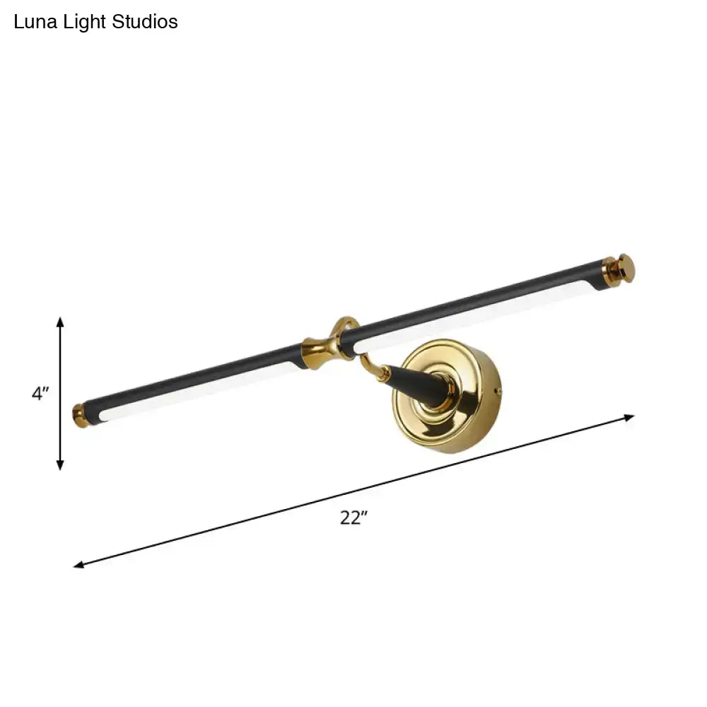 Modern black and gold led vanity wall light with a sleek brass 22-inch bar and circular gold base for bathroom use