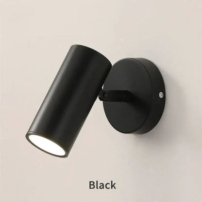 Modern black led wall lamp with cylindrical matte finish and adjustable head for bedroom use
