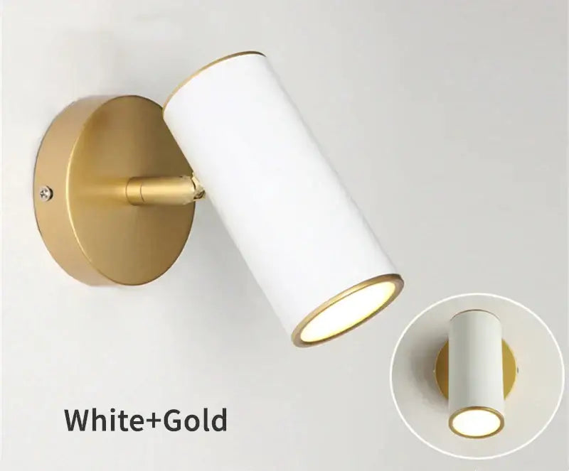 Modern black and gold led wall lamp with white cylindrical sconce and adjustable sleek design for bedroom lighting