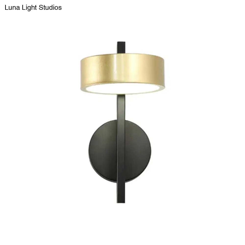 Modern wall lamp with a sleek black metal base and polished gold circular shade for bedroom reading in 110v-120v 220v-240v use