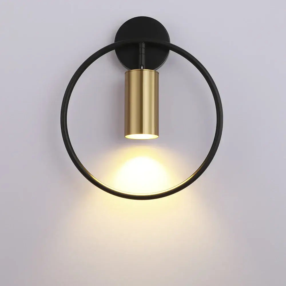 Modern black and gold led wall lamp with circular minimalist design perfect for living room and bedroom lighting