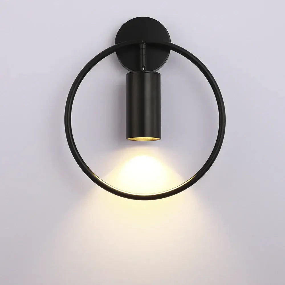 Modern black and gold led wall lamp with matte finish and warm focused light for living room or bedroom use