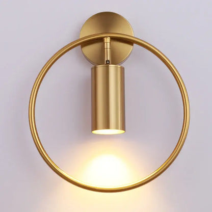 Modern black and gold led wall lamp with gold-finished circular sconce and cylindrical light fixture for living room