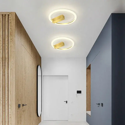 Modern black and gold led wall lamp with circular ceiling lights and gold accents for living room lighting
