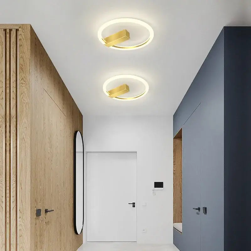 Modern black and gold led wall lamp with circular ceiling lights and gold accents for living room lighting