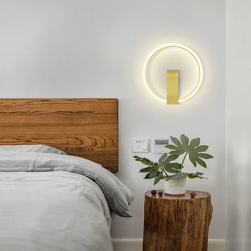Gold circular modern led wall lamp with glowing ring and vertical bar accent for living room wall decor