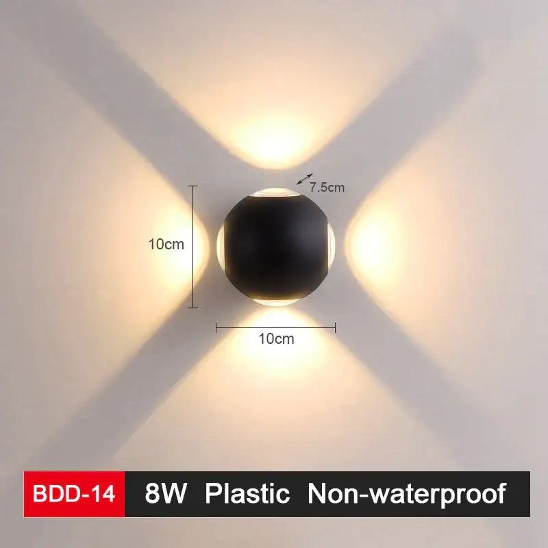 Modern black and gold led wall lamp with glossy spherical design emitting warm white x-shaped illumination for living room decorbites led wall