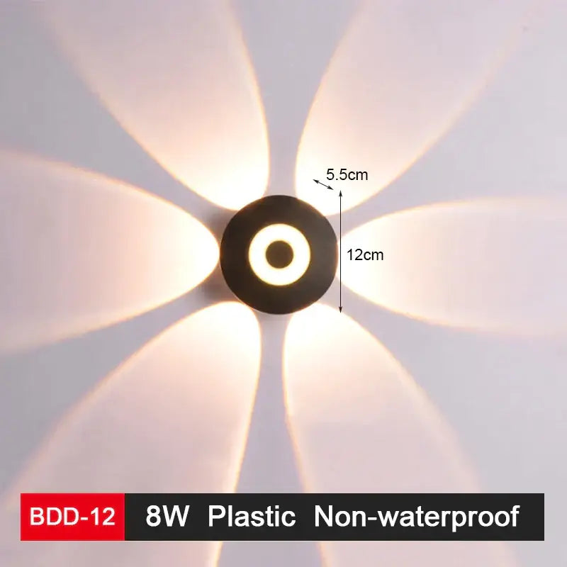 Modern black and gold wall lamp with a circular center and six petal-like arms using warm white decorbites led wall lighting