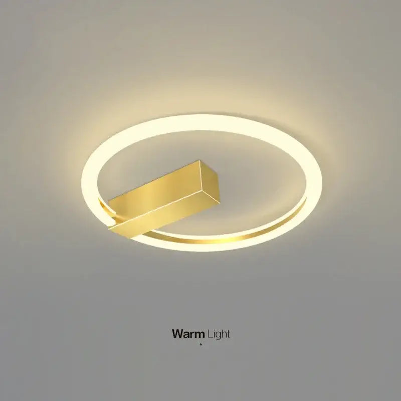 Modern black and gold led wall lamp with gold-toned circular design and warm illumination for living room