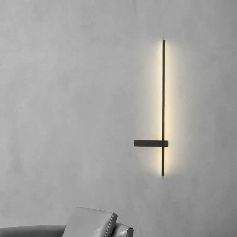 Minimalist black metal led wall lamp with vertical illuminated bar and horizontal crossbar for modern living room use