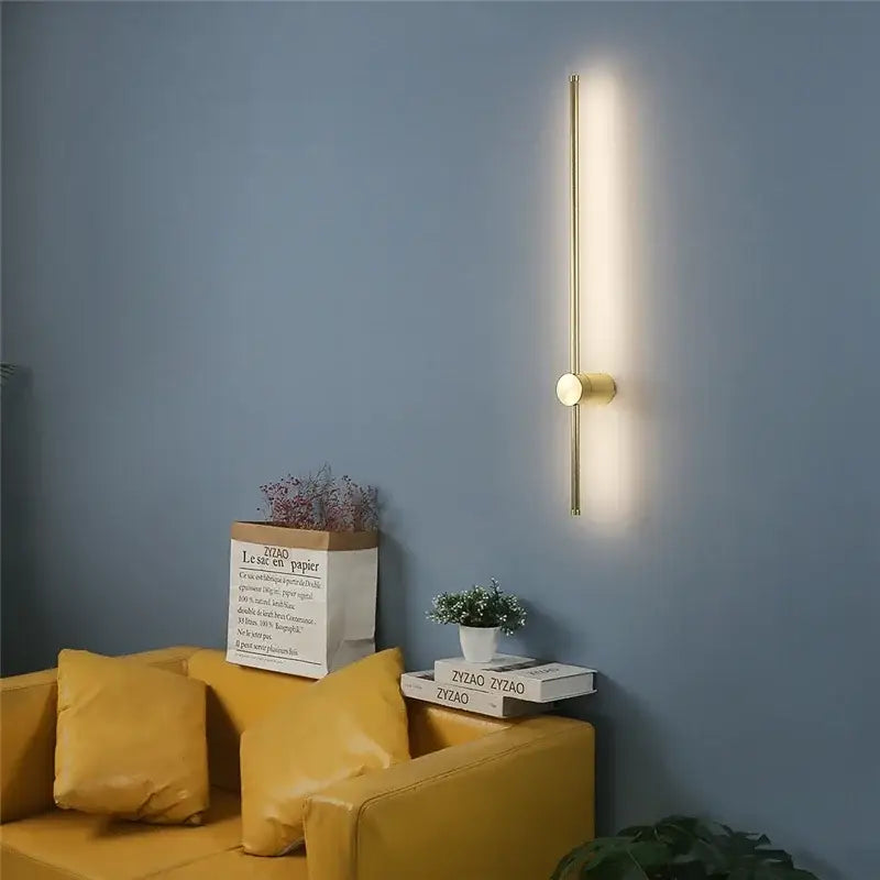 Gold-toned minimalist wall lamps with sleek vertical bar and circular accent for modern black gold led wall lamps decorbites led wall