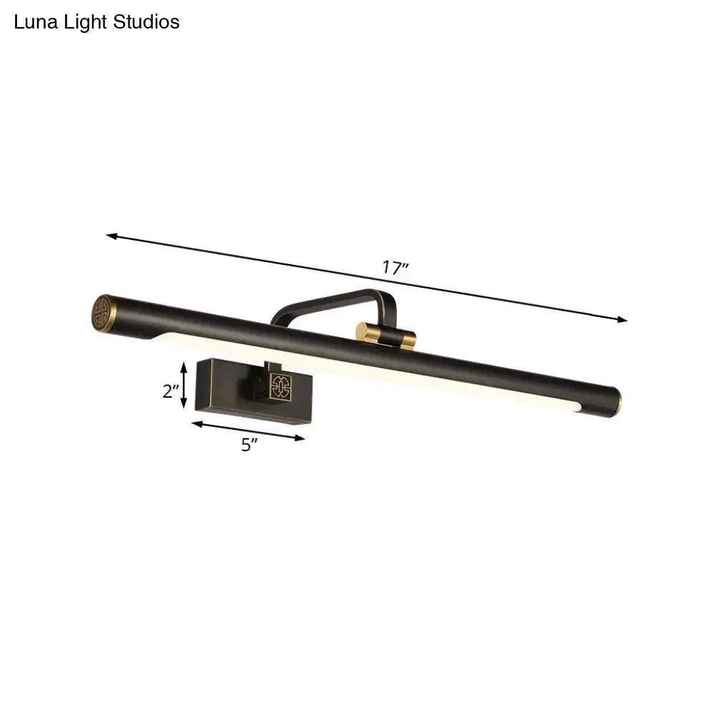 Modern black and gold wall light with bronze finish and bulb base featuring a sleek bathroom vanity design
