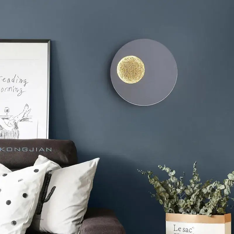 Modern black and gold led wall lights with a matte gray ring and illuminated golden textured center for bedroom decorbites led wall