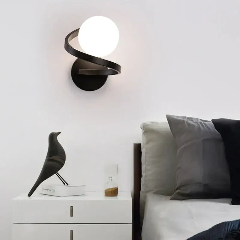 Modern black metal wall lights with sleek spiraling design and frosted globe for bedroom decorbites black copper led wall
