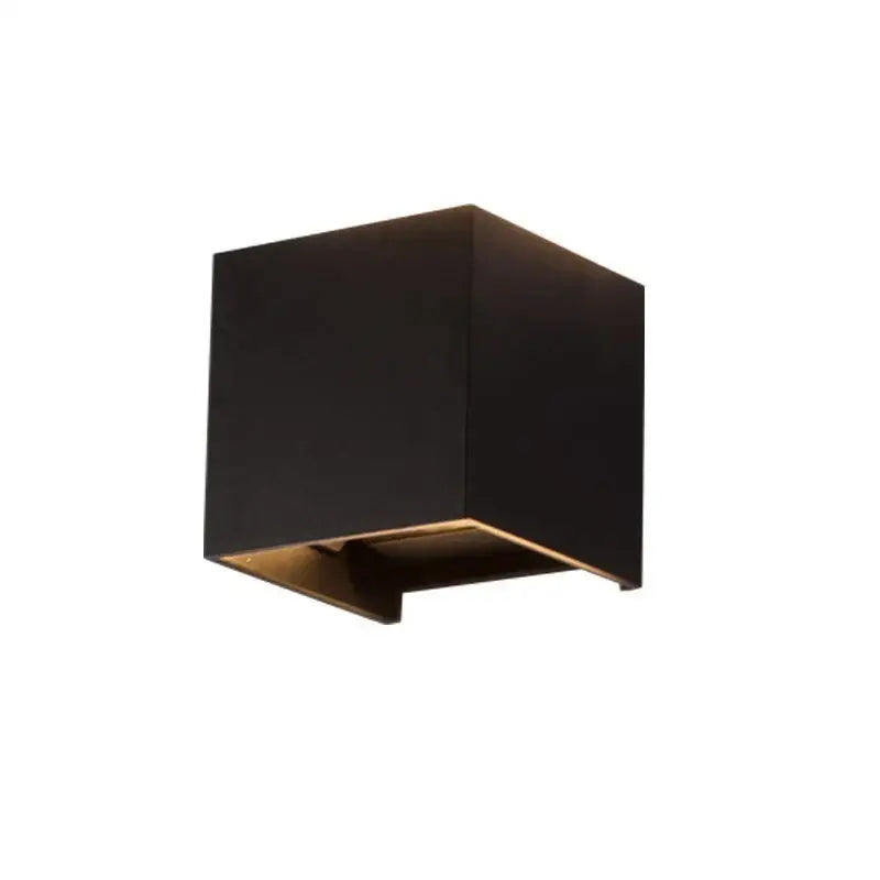 Modern black and gold led wall lights featuring a cube sconce with gold interior accent by decorbites led wall