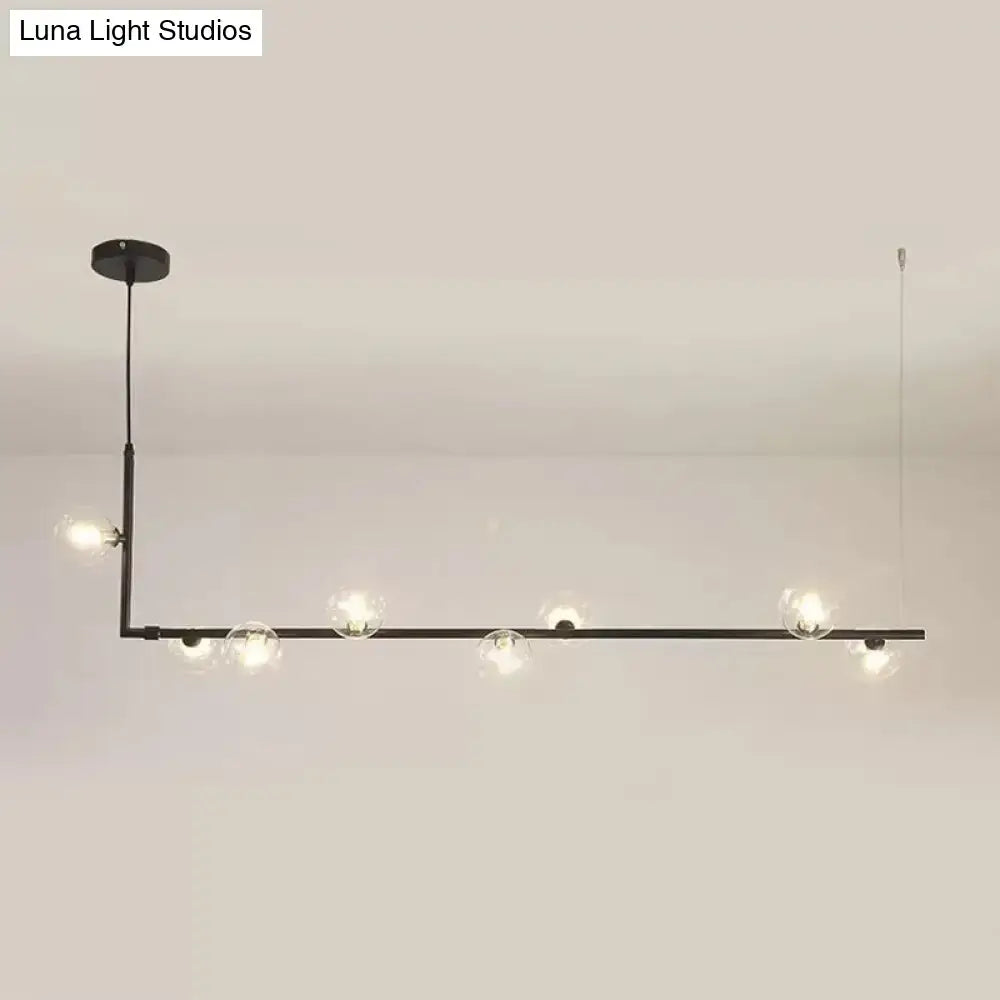 Modern black gold linear chandelier with clear glass globe bulbs for dining room or kitchen island lighting