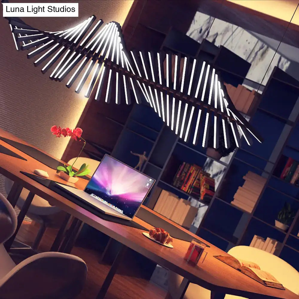 Modern black and white pendant light fixture with wing-like segmented design 220v-240v suspended above desk
