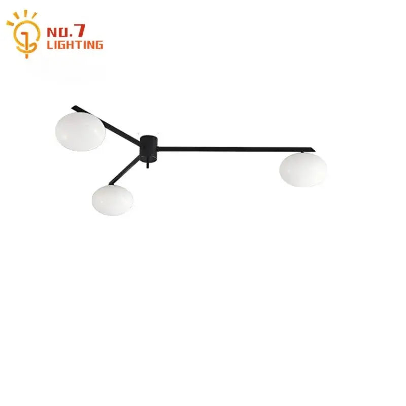 Modern black and gold lustre ceiling light fixture with three frosted white glass globes for kitchen lighting