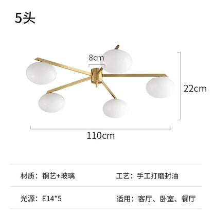 Modern black and gold lustre ceiling light fixture featuring five frosted glass globe shades for kitchen use