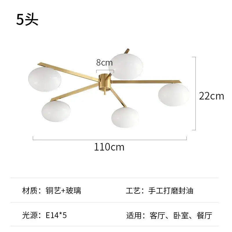 Modern black and gold lustre ceiling light fixture featuring five frosted glass globe shades for kitchen use