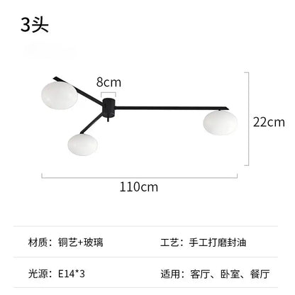 Modern black metal and gold lustre ceiling light with three frosted glass globes for kitchen use light fixture