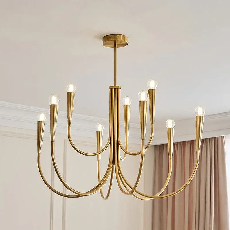 Modern black gold metal chandelier with nine sleek curved arms and exposed bulbs for dining room decorbites gold metal