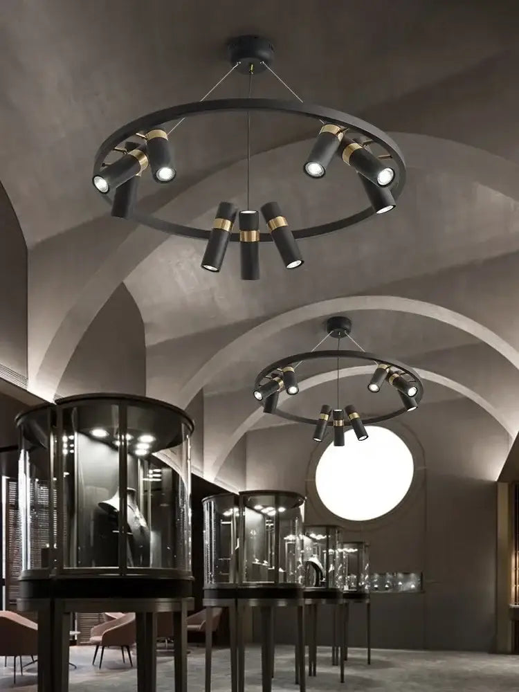 Modern black metal circle pendant light with gold-accented cylindrical spotlights for kitchen decorbites decor