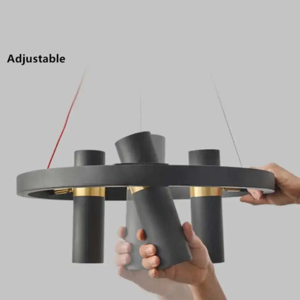 Modern black and gold metal circle pendant light with adjustable cylindrical arms for kitchen decorbites black metal decor