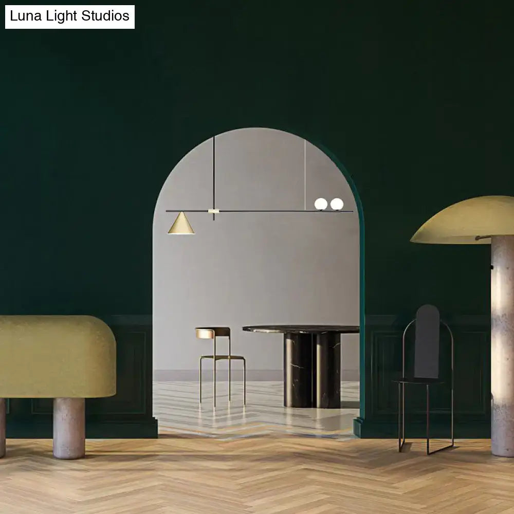Modern black and gold metal cone island light with sleek frame and mixed white and gold shades for dining room lighting