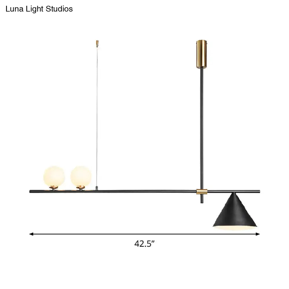 Modern black and gold metal cone island light featuring two frosted glass bulbs and a conical shade for dining room