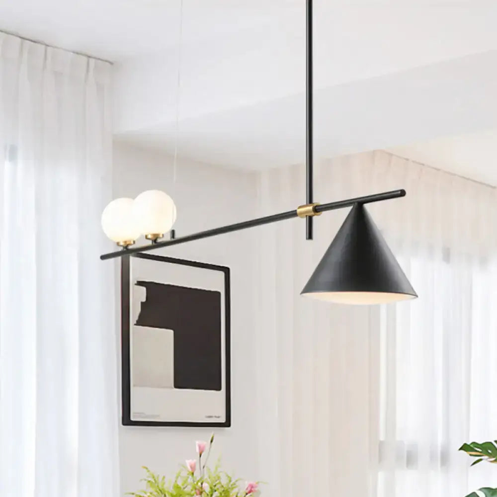 Modern black and gold metal cone island light with sleek horizontal bar and glass bulbs for dining room lighting