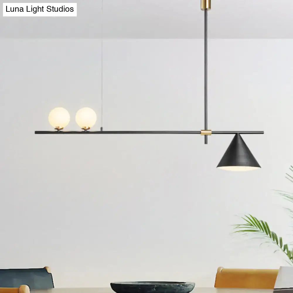 Modern black and gold metal cone island light with frosted glass bulbs and brass fittings for dining room lighting