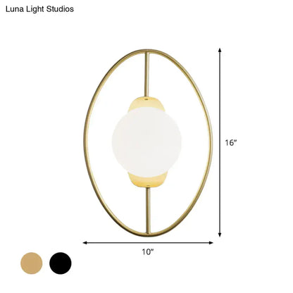 Modern black and gold metal halo ring wall lamp with white glass globe and minimalist oval metal frame for bedroom