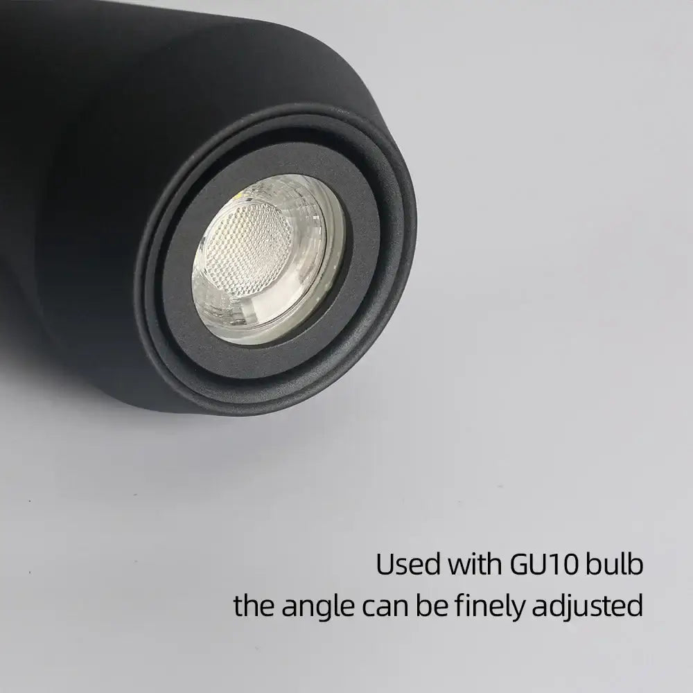 Modern black metal pendant chandelier featuring a black cylindrical recessed spotlight with gu10 bulb socket and adjustable angle