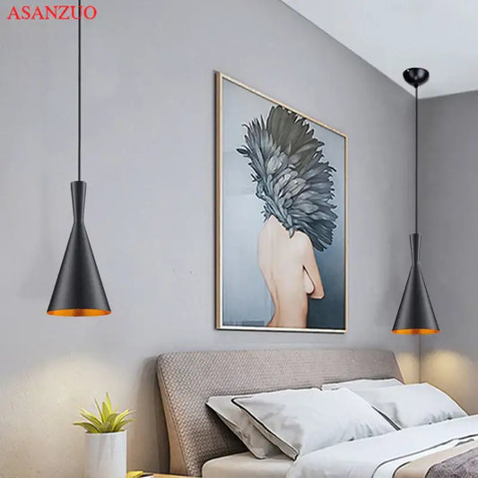 Modern black and gold musical pendant light with conical shape and gold-lined interiors for dining room lighting