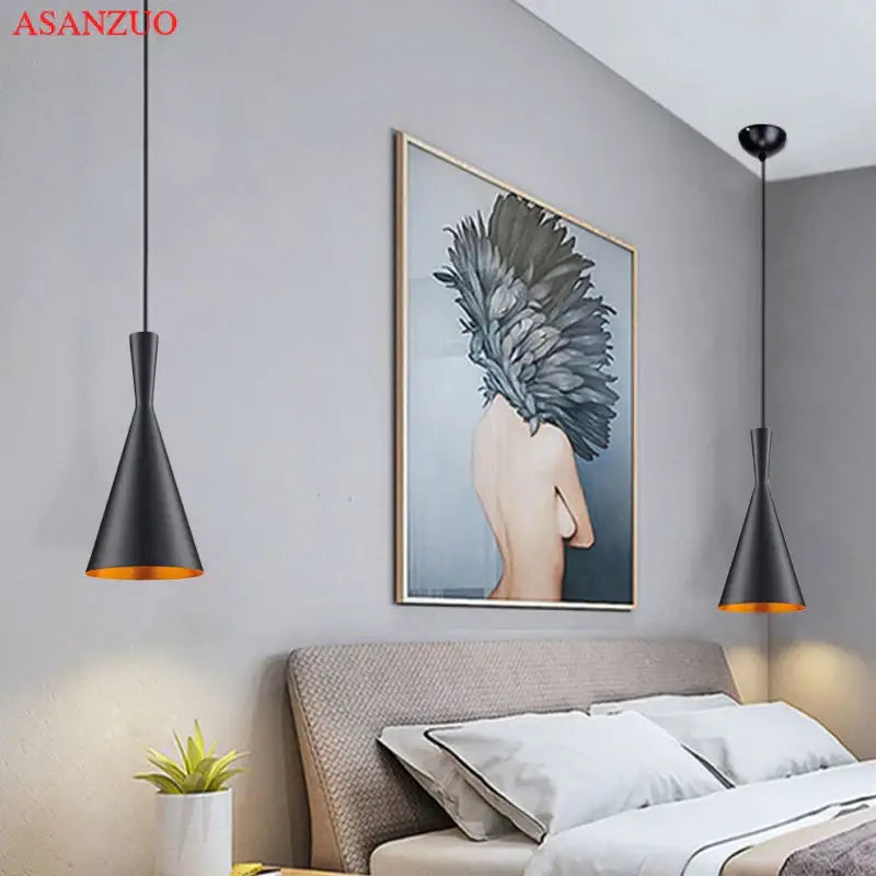 Modern black and gold musical pendant light with conical shape and gold-lined interiors for dining room lighting
