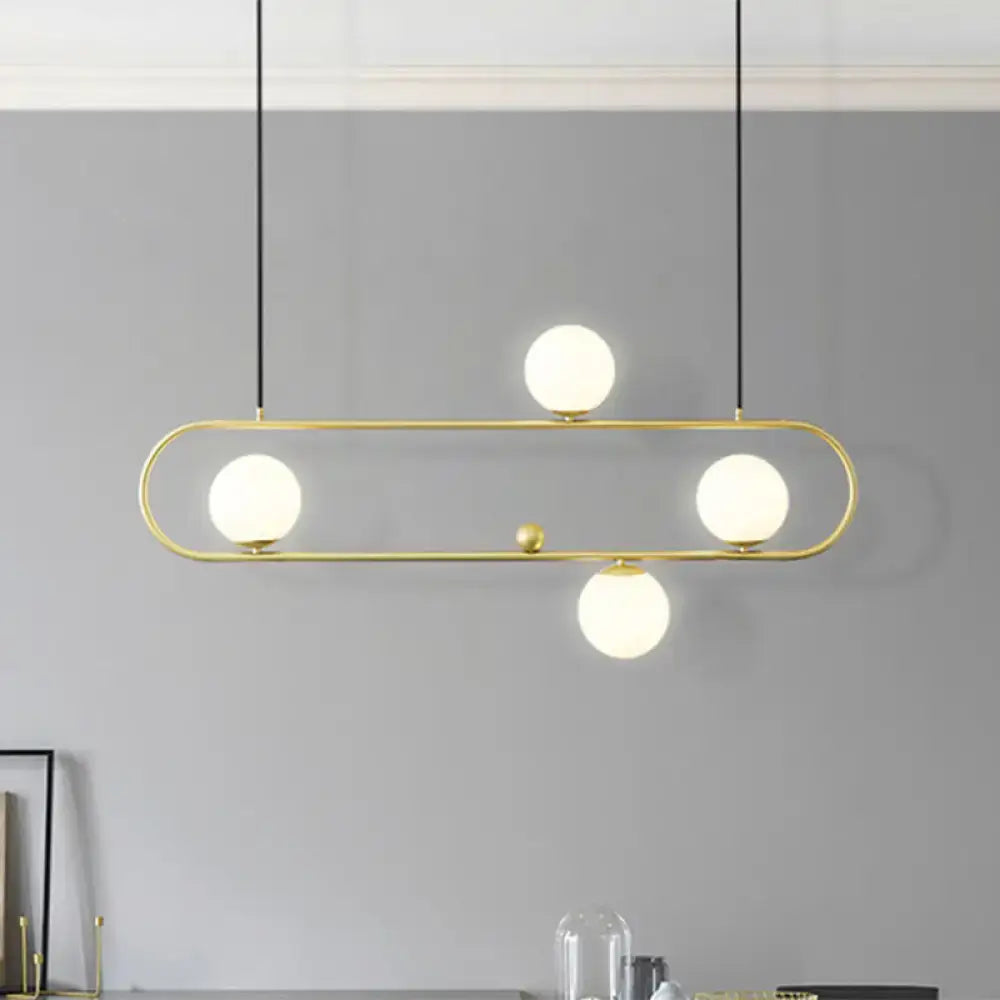 DecorBites modern black gold pendant light with four frosted opal glass globes for dining room ceiling or island lighting