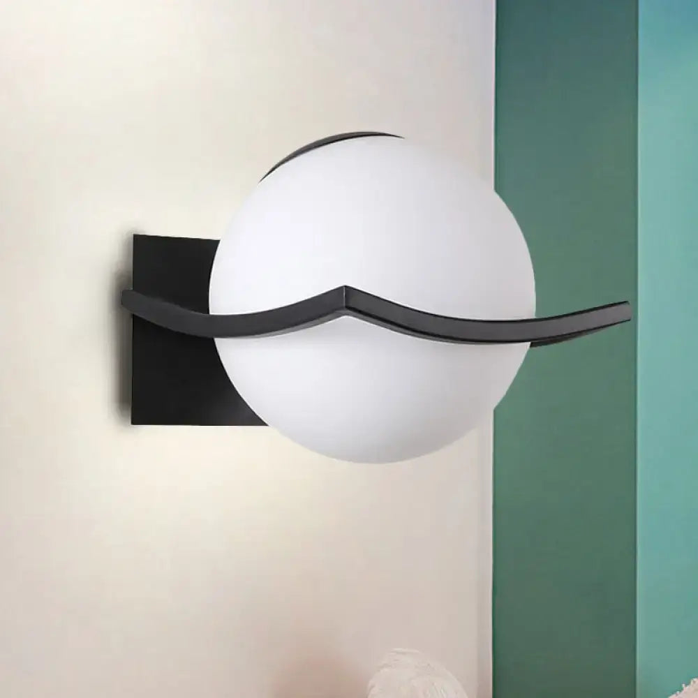 Modern black wall sconce with opal glass globe and sleek metal bracket ideal for bedroom led incandescent fluorescent lighting