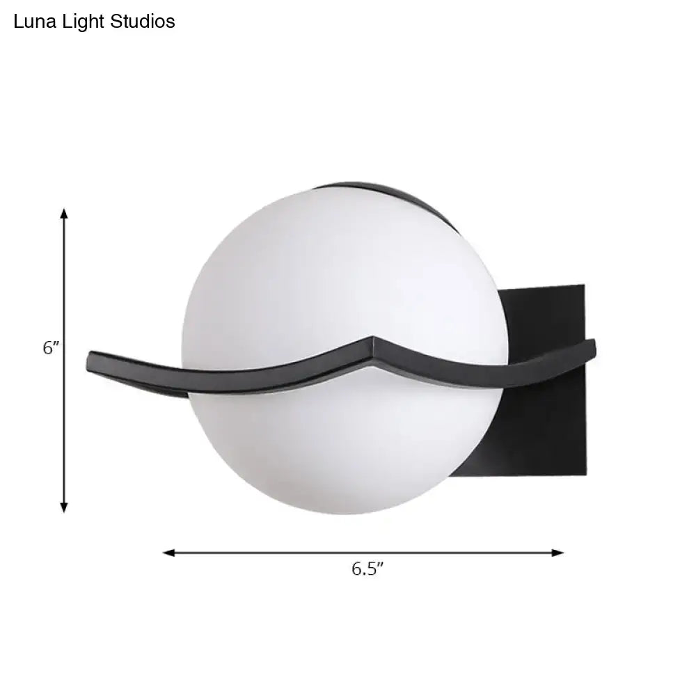 Modern black and white wall sconce with opal glass globe and curved metal accent for bedroom led incandescent fluorescent use