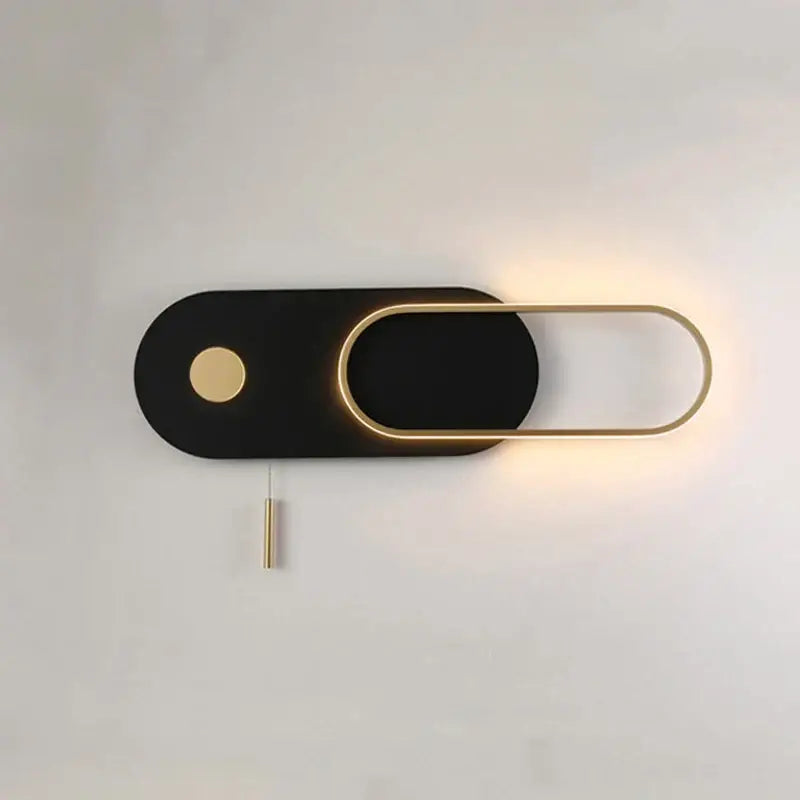 Modern black and gold oval led wall lamp with sleek minimalist design featuring an illuminated frame for bedroom sconce