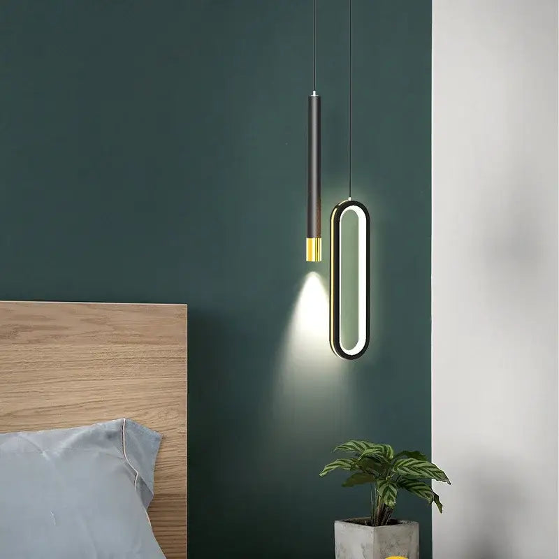 Modern black and gold oval pendant lamps featuring sleek cylindrical black pendant lamps for minimalist bedroom decorbites lighting