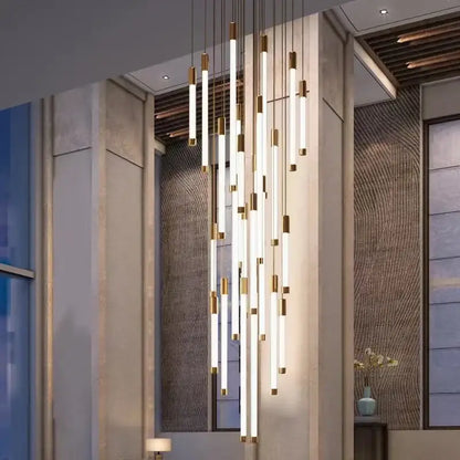 Modern black and gold pendant chandelier with gold-accented illuminated cylindrical tubes and polished steel details