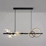 Modern black metal and gold pendant light with clear glass globe bulbs for dining room illumination