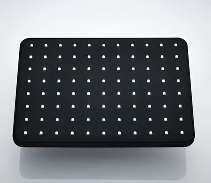 Black rectangular pegboard with evenly spaced white holes as a back panel for modern black rainfall shower head bathroom handshower