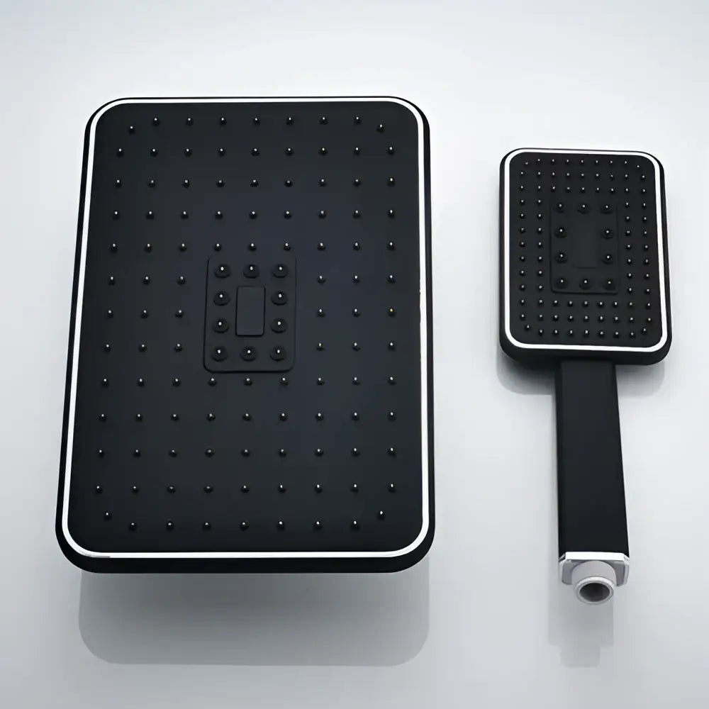 Modern black rainfall shower head with silver trim and matching handheld shower unit for bathroom use