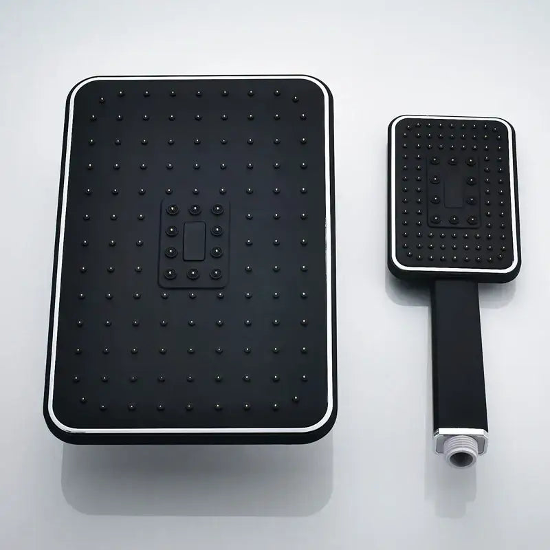 Modern black and gold rainfall shower head set with black rectangular shower head and chrome handheld shower set